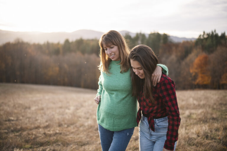 Teenage Girl And Mother On A Walk In Nature