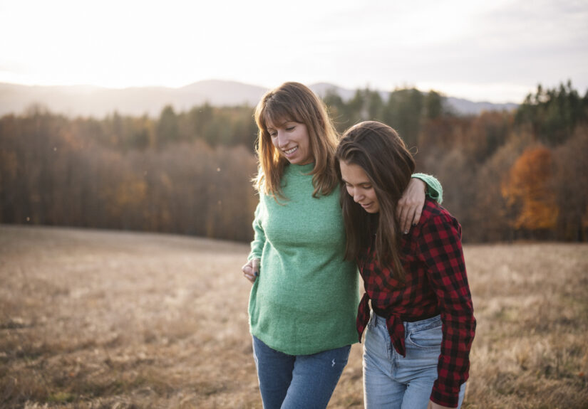 Teenage Girl And Mother On A Walk In Nature